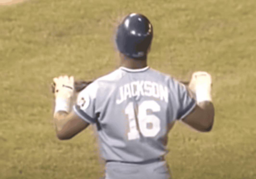 Bo Jackson in action, showcasing his dual athletic prowess in baseball and football.